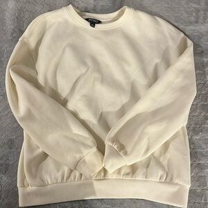 yellowish white sweater or long sleeve